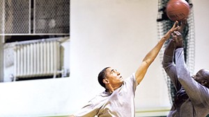 President Barack Obama playing basketball with personal aide Reggie Love