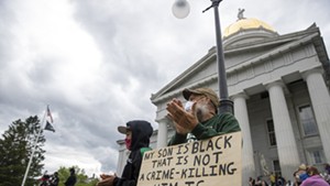 Protesters listen to speakers at a demonstration in Montpelier