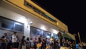Protesters in front of the Burlington Police Department