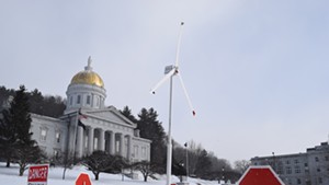 Vermont wind project opponents erected a model turbine on the Statehouse lawn.