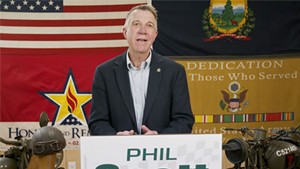 Gov. Phil Scott declares victory Tuesday in a video shot in his motorcycle garage.