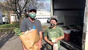Kyle Doda (left) and Betsy Simpson of 1000 Stone Farm in Brookfield making a delivery in Burlington