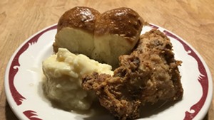 Hen of the Wood fried chicken, mashed potatoes and Parker House rolls