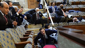 Rep. Peter Welch (far right) and others duck for cover in the U.S. House gallery
