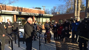 Bernie Sanders talks to reporters after voting in the New North End.