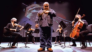 Ray Vega (center) and members of the Vermont Symphony Orchestra