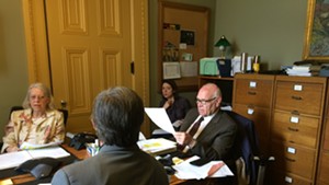 Sen. Dick Sears (D-Bennington) and Sen. Peg Flory (R-Rutland) negotiate with Rep. Chip Conquest (D-Newbury), with his back to the camera, on driver’s license-suspension legislation.
