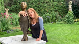 Leslie Fry in her sculpture garden in Winooski