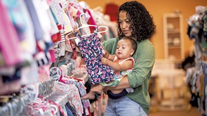 Maria Munroe and her 9-month-old daughter, Malia, shopping at Boho Baby