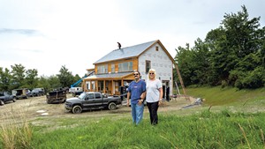 Phil and Debbie Gianelli in front of their Hinesburg home build