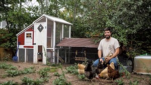 Will Andrews in his backyard chicken coop
