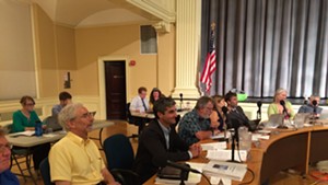 Chief administrative officer Bob Rusten, far left, sits next to Mayor Miro Weinberger at Monday's council meeting.