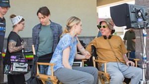 Director Todd Solondz (far right) talks with Greta Gerwig on the set of Wiener-Dog.