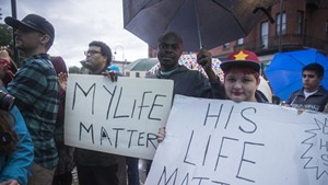More than 100 people turned out on Saturday for a protest and vigil against police shootings.
