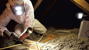 Brian Hyde of Energy Co-op of Vermont sealing gaps in a Colchester attic