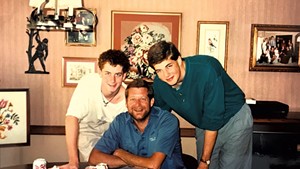 Benjamin (left) with his dad and brother