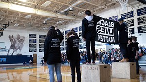 Randolph Union High School students raising the Black Lives Matter flag in 2019