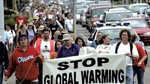 Protesters participating in a walk along Route 7 in South Burlington, September 4, 2006
