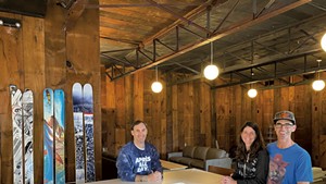 From left: J Skis headquarters manager Doug Stewart with Corrine and J Levinthal in the company's lounge and bar