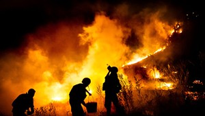 Soldiers of the 46th battalion of the army of Ukraine try to extinguish fire due to mortar shelling by separatists, Mariinka, Donetsk region, Ukraine, August 23, 2016.