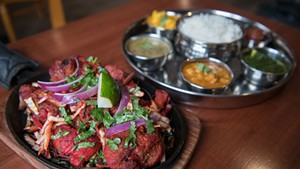 Tandoori chicken and vegetable thali at Laliguras Indian Nepali Restaurant.