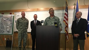Major General Steven Cray announces a deployment to the Middle East. Behind him, from left, are Col. Patrick Guinee, governor-elect Phil Scott and U.S. Rep. Peter Welch (D-Vt.).