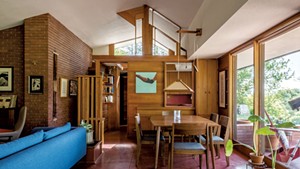 Open-plan dining and living areas at the home of Tammy Heesakker and Gregory Russo in Norwich