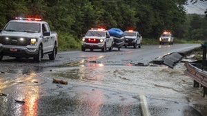 Crews along flooded Route 103 in Chester
