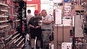 Bob Nelson (left) helping a customer