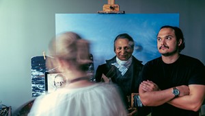 Katie Runde painting Twilight's Statehouse portrait while Demetrius Borge poses