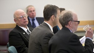 Norm McAllister with his legal team during jury selection at court in St. Albans Tuesday
