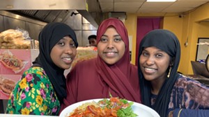 From left: Amina, Bahja and Qamar Ibrahim with Somali rice and chicken