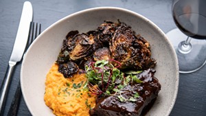 Beer-braised boneless short rib, sweet potato pur&eacute;e and fried Brussels sprouts