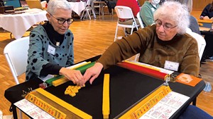 Lynda Siegel (left) playing mah-jongg