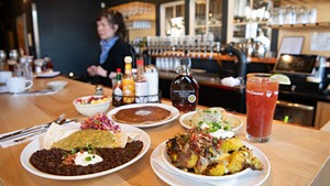 Huevos verdes, fresh fruit cup, griddled gingerbread pancake, biscuits and gravy, michelada, and House of Spudology home fries