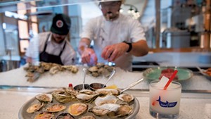 Oysters and littleneck clams with a frozen gin and tonic at the raw bar at Original Skiff Fish + Oysters