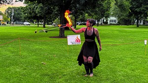 Elise Turcketta spinning fire at Burlington Burn Club