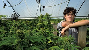 Oliver Duncan of Good Pot Co. in his light-deprivation cannabis greenhouse in Addison County