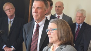 Gov. Phil Scott and his legal counsel, Jaye Pershing Johnson, at a press conference Tuesday
