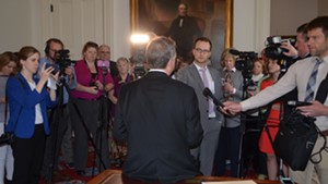 Gov. Phil Scott addresses reporters in his ceremonial office last week.