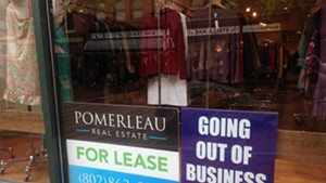 Signs in the 2nd Time Around store window