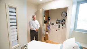 Emergency Department director Tom Rounds in a room outfitted for mental health patients at Rutland Regional Medical Center