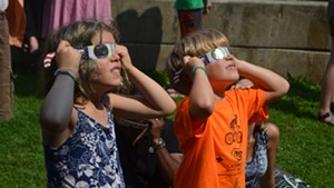 Kids take in the solar eclipse at the Fletcher Free Library in Burlington