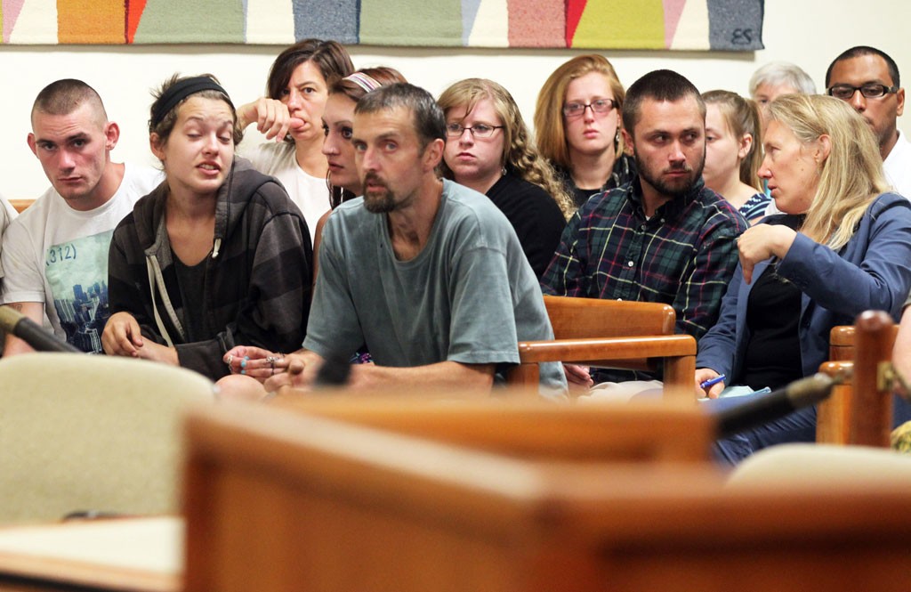 Desiree Herring and Felicia Kennison, center of front row, at their mother's arraignment Monday - TOBY TALBOT/ASSOCIATED PRESS
