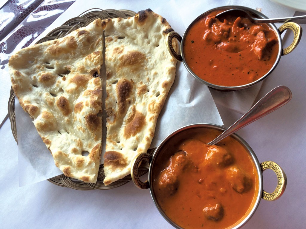Butter chicken and malai kofta with naan at India's Oven - ALICE LEVITT