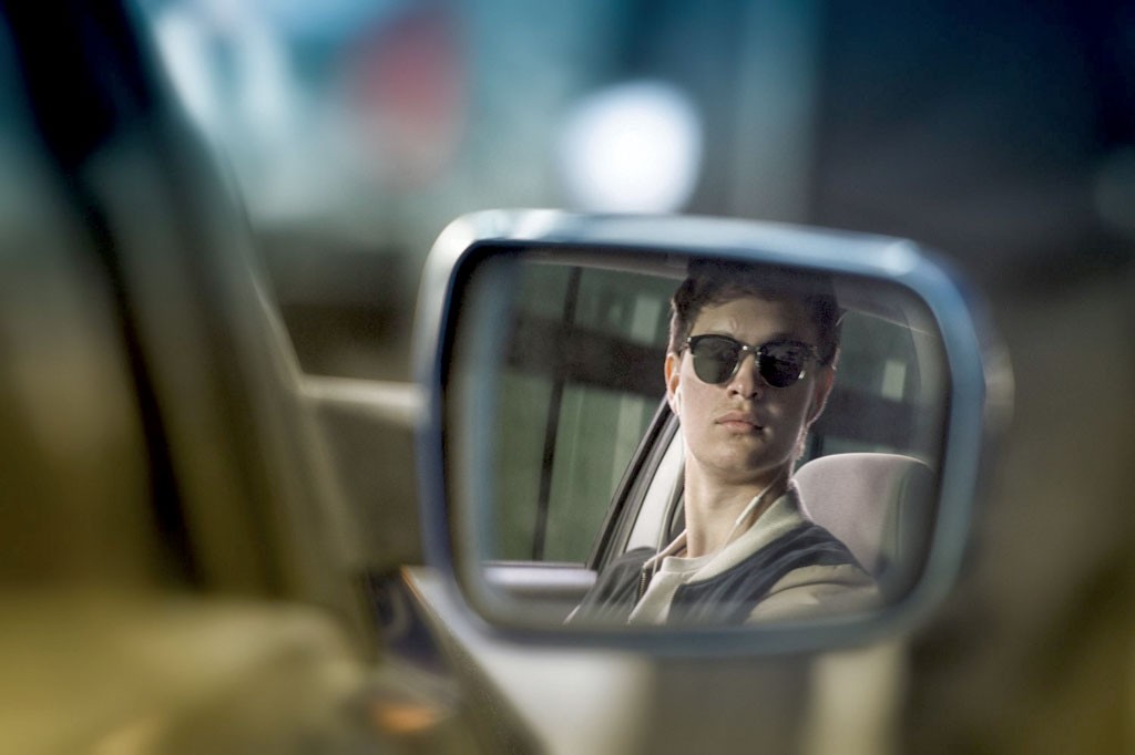 WHEEL WIZARD Elgort plays a getaway driver who’s never without his tunes in Wright’s musical action flick.