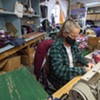 A worker sewing clothing at Vermont Flannel